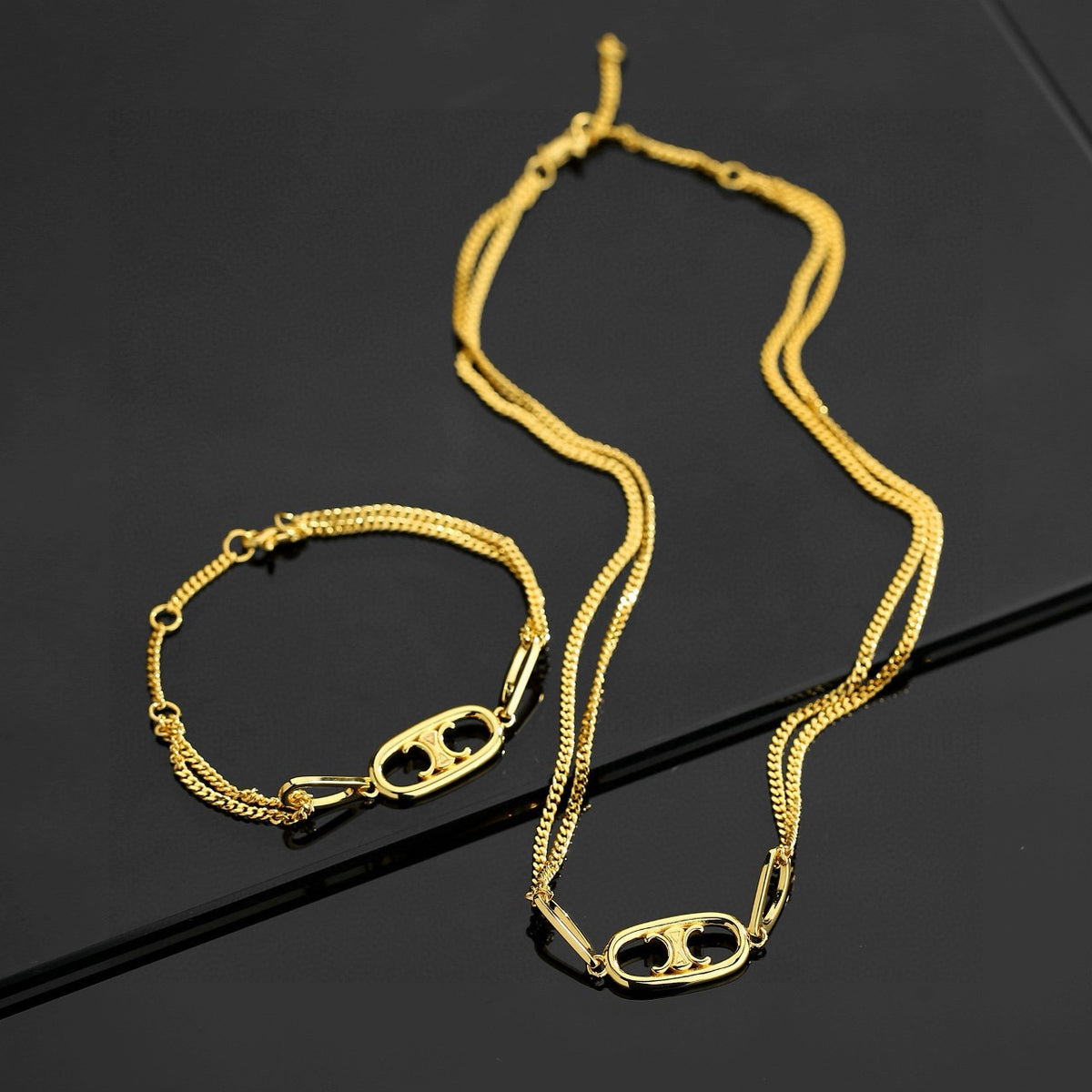 CELINE Gold-Tone Emblem Necklace & Bracelet Set – Evening Edit