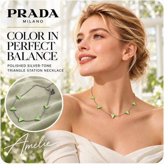 Prada silver-tone station necklace with green triangle details worn by a blonde model outdoors
