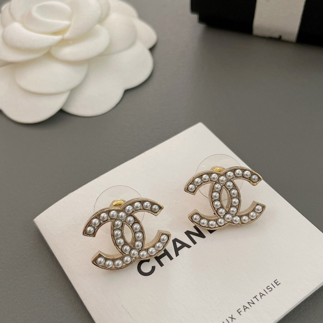 beige pearl double c Stud Earrings for women - product detail view