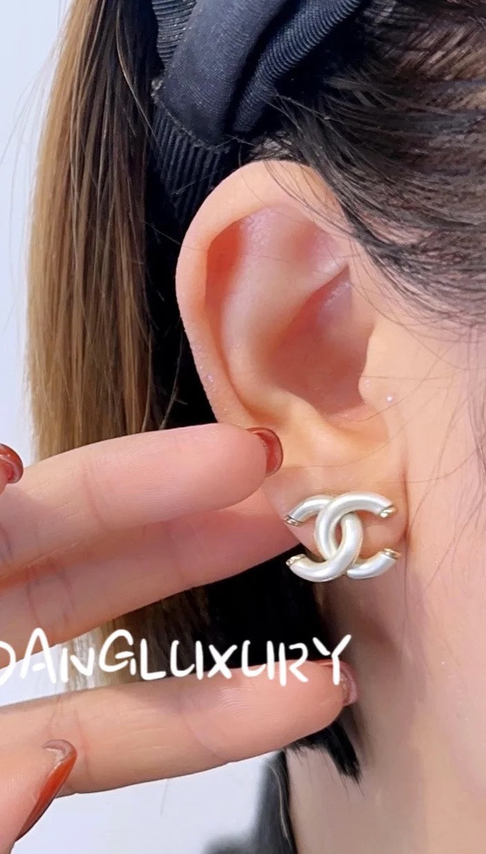 light gold acrylic double c Stud Earrings for women - product detail view