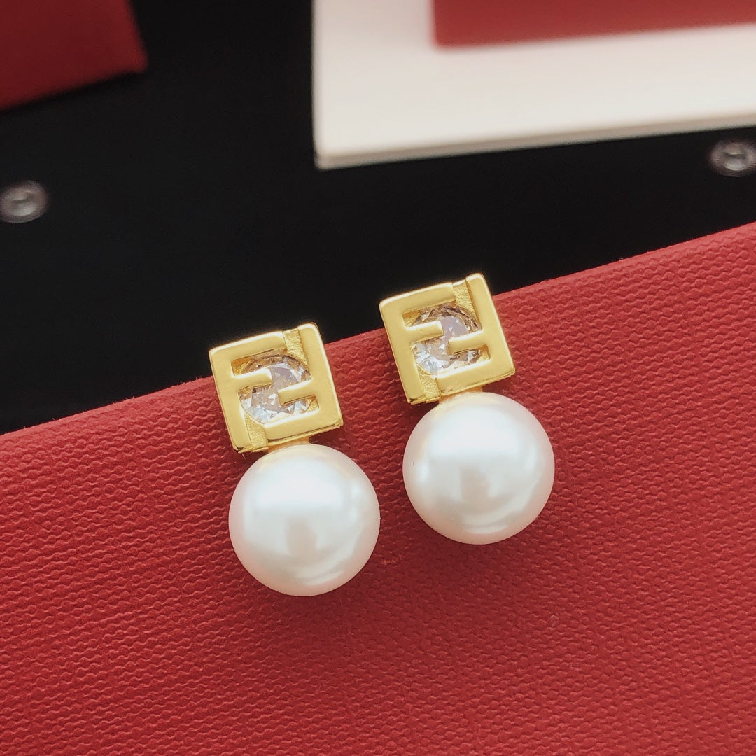 yellow brass pearl Stud Earrings for women - product detail view