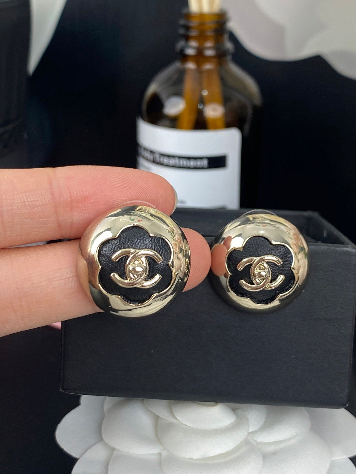 gold leather floral Stud Earrings for women - alternate angle view 4