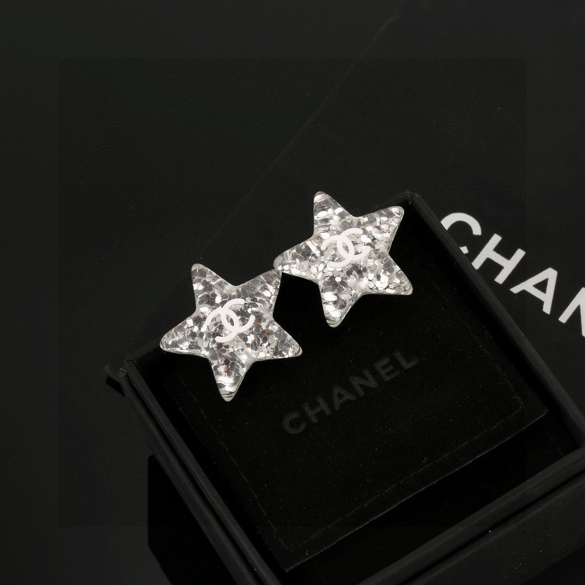 silver acrylic star Stud Earrings for women - product detail view
