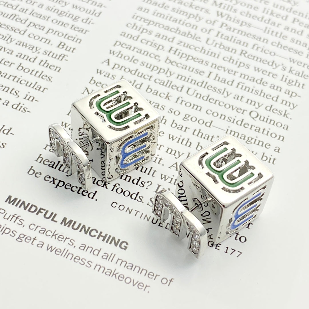 silver crystal letter Stud Earrings for women - product detail view