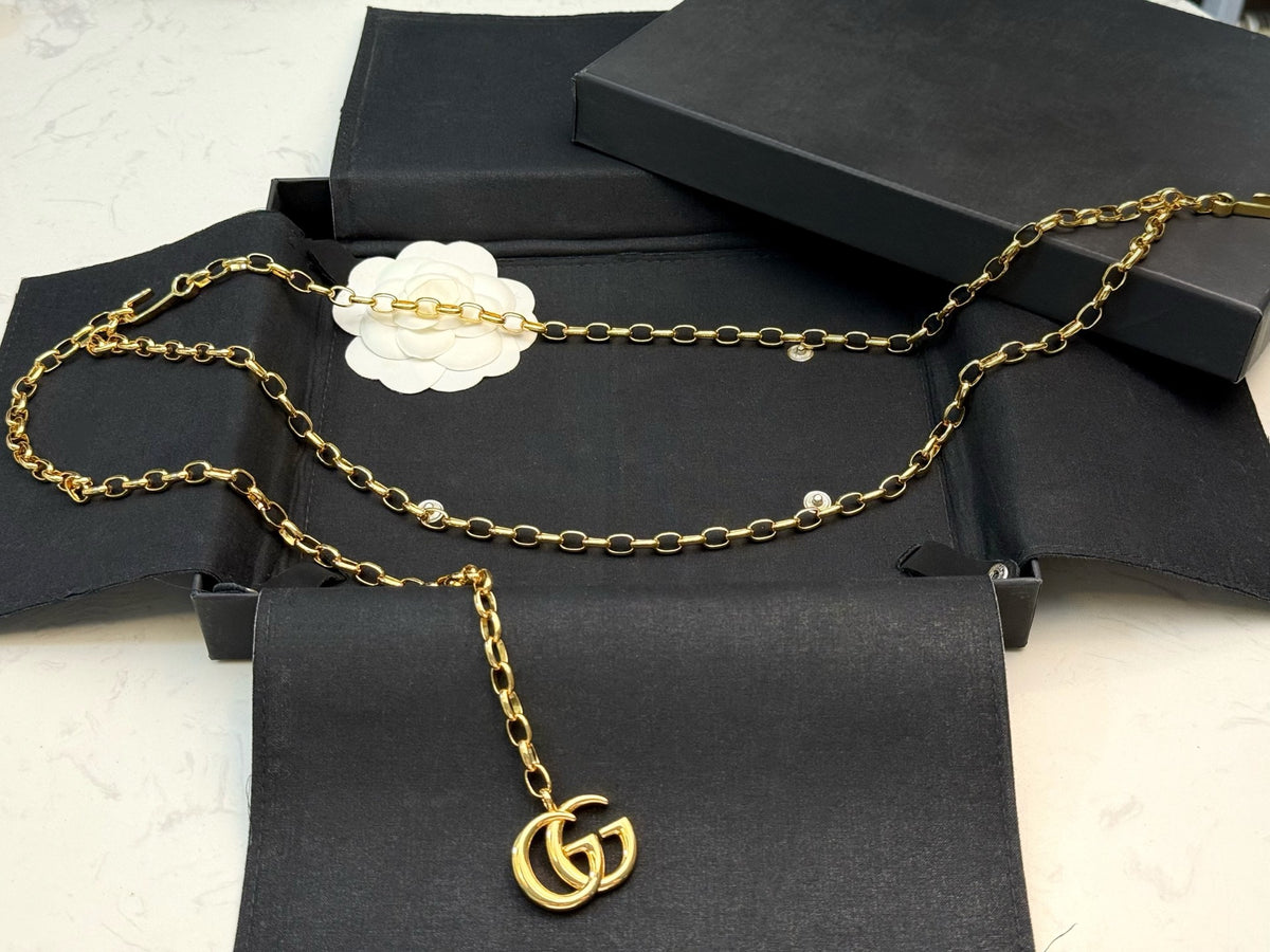 gold brass double g Shorts for men and women - alternate angle view 4